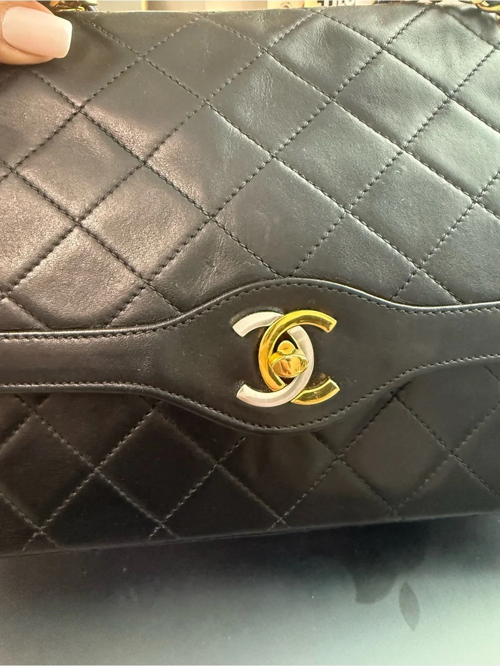 CHANEL Black Quilted Leather Shoulder Bag with Gold Chain Strap